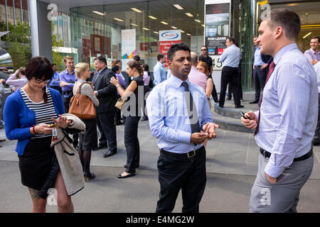 Melbourne Australia,Victoria CBD Central Business,District,William Street,office workers,outside building,during fire alarm,Asian Asians ethnic immigr Stock Photo