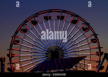 Colourful ferris wheel at dusk, Pacific Park, Santa Monica Pier, Santa Monica, Los Angeles, California, USA Stock Photo