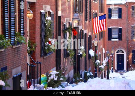 Beautiful Acorn Street in the historic Beacon Hill neighborhood of Boston, Massachusetts in winter with snow. Stock Photo