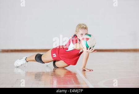 girl playing volleyball game Stock Photo