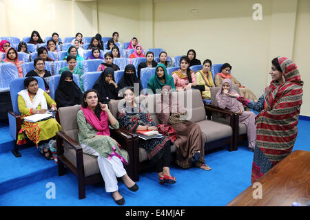 Professor and female Students during a lecture at the female campus of the Islamic University, Islamabad, Pakistan Stock Photo