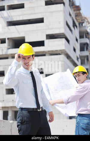 Team of architects on construciton site Stock Photo