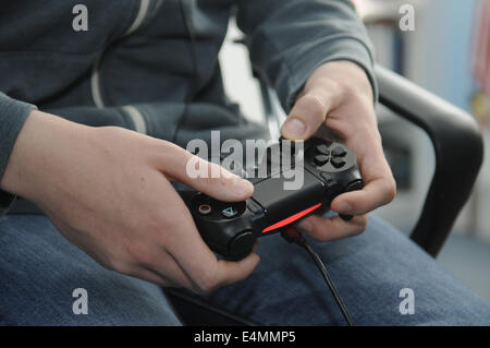 Close up of a teenage boy playing a computer game. Stock Photo