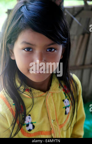 SIEM REAP, CAMBODIA - APRIL 06, 2014: Unknown cute and happy little Asian girl smiling at camera in Siem Reap 06 April 2014, Cam Stock Photo