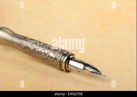 Feather quill an old paper Stock Photo