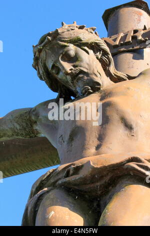 Jesus Christ on the cross over blue sky with clouds Stock Photo - Alamy