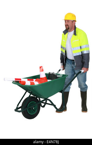 bricklayer with wheelbarrow Stock Photo