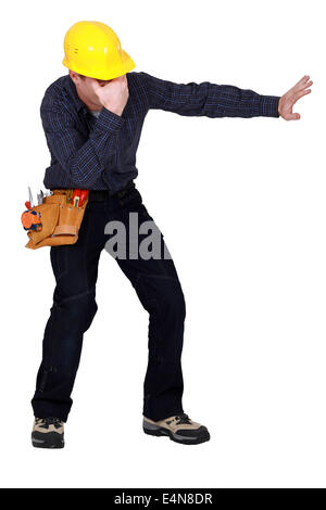 Laborer gesturing on white background Stock Photo