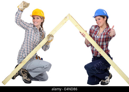 Female carpenters rejoicing Stock Photo