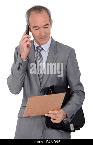 Businessman on mobile phone Stock Photo