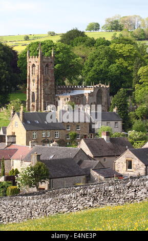 St Giles Church rises above Hartington village in the White Peak, Peak District National Park, Derbyshire, UK - early summer Stock Photo