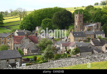 St Giles Church rises above Hartington village in the White Peak, Peak District National Park, Derbyshire, UK - early summer Stock Photo