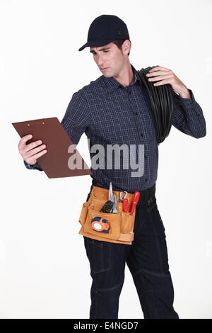 Electrician with a clipboard Stock Photo