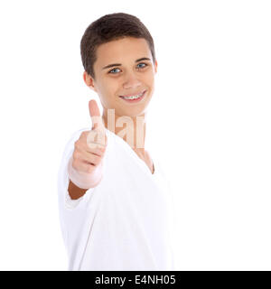 Smiling teenage boy giving thumbs up Stock Photo