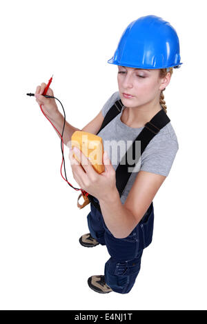Woman taking electrical reading Stock Photo