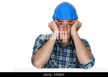 Bored construction worker Stock Photo