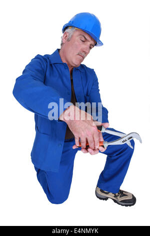 Man using a spanner on empty copyspace Stock Photo
