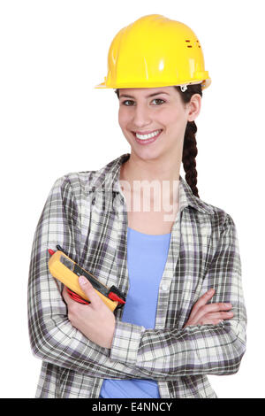 Woman holt a voltmeter Stock Photo