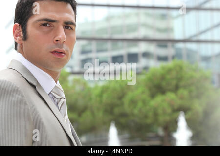 Young businessman looking concerned Stock Photo