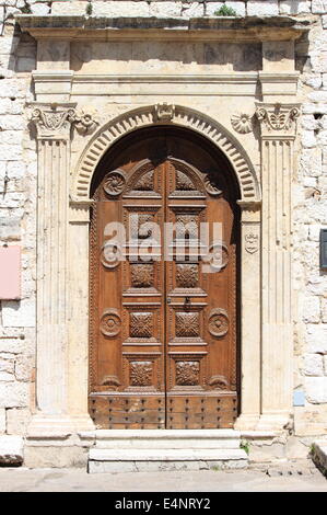 Medieval front door with decorations Stock Photo