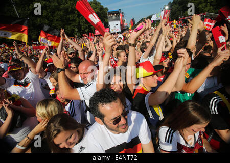Berlin, Germany. 15th July, 2014. German football fans celebrate to mark their 2014 Brazil World Cup victory in Berlin, Germany, July 15, 2014. Germany's team returned home on Tuesday after winning the 2014 Brazil World Cup. Credit:  Zhang Fan/Xinhua/Alamy Live News Stock Photo