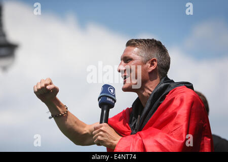Berlin, Germany. 15th July, 2014. German football player Bastian Schweinsteiger gestures during celebration to mark the team's 2014 Brazil World Cup victory in Berlin, Germany, July 15, 2014. Germany's team returned home on Tuesday after winning the 2014 Brazil World Cup. Credit:  Zhang Fan/Xinhua/Alamy Live News Stock Photo