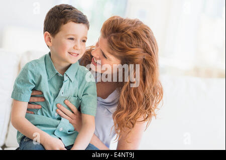 Mother embracing son (6-7) Stock Photo