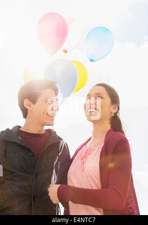 Young couple with balloons