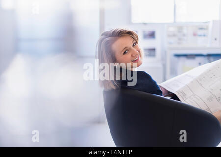 Portrait of smiling business woman in office Stock Photo