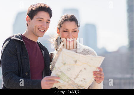Young couple looking at map Stock Photo