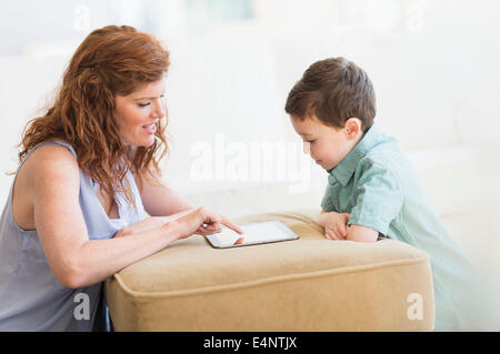 Mother and son (6-7) using digital tablet Stock Photo