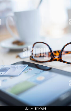 Close up of credit card on digital tablet Stock Photo