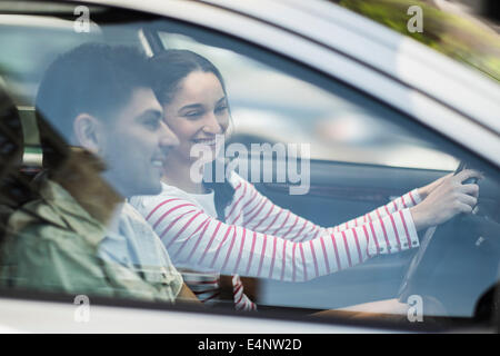 Young couple traveling in car Stock Photo
