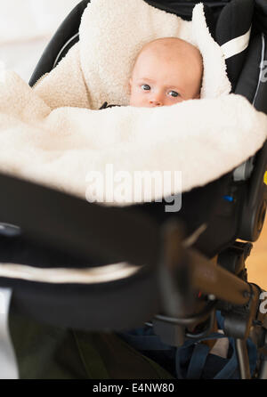 Portrait of baby boy (2-5 months) sitting in stroller Stock Photo
