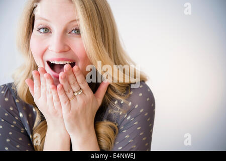 Portrait of blond woman smiling Stock Photo