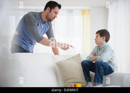 Angry father scolding his son Stock Photo - Alamy