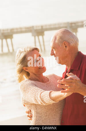 USA, Florida, Jupiter, Senior couple dancing on beach Stock Photo