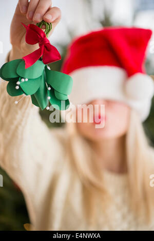 Woman colding christmas decoration Stock Photo