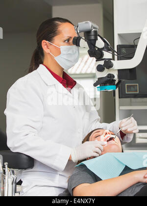 Dentist operation on patient Stock Photo
