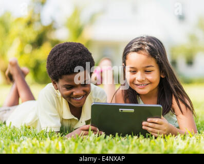 USA, Florida, Jupiter, Girl (8-9) and boy (6-7) using digital tablet Stock Photo