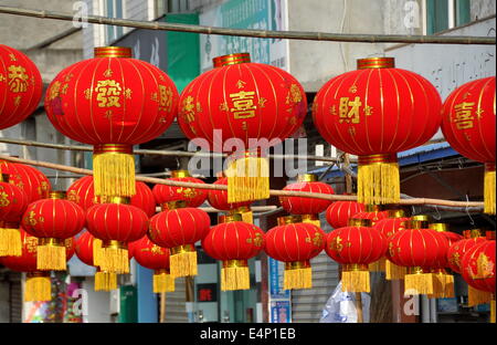 Jun Le, china:  Rows of bright red lanterns for the Chinese Lunar New Year holiday hang in front of a hardware store