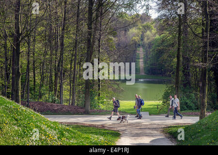 Tourists walking in the park of the medieval Gaasbeek Castle at Lennik, Flemish Brabant, Belgium Stock Photo