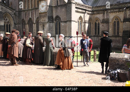 Wells, Somerset, UK. 15th July, 2014. The BBC are filming a new drama called 'Wolf Hall' based on the book by Hilary Mantel. The six part series focuses on the politics of despotism between King Henry VIII and Thomas Cromwell. Filming took place at Wells Cathedral today and the series will be screened in early 2015. Stock Photo