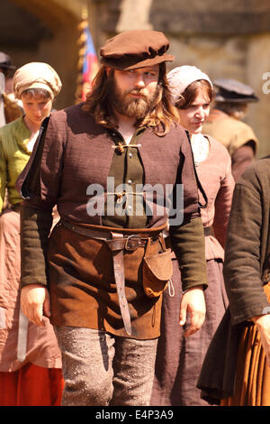 Wells, Somerset, UK. 15th July, 2014. The BBC are filming a new drama called 'Wolf Hall' based on the book by Hilary Mantel. Filming took place at Wells Cathedral today and the series will be screened in early 2015. Stock Photo