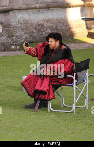 Actor Damian Lewis as Henry VIII taking a break during the BBC filming of a new 6 part mini series based on the book Wolf Hall. Wells Somerset July 2014 Stock Photo