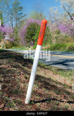 Warning post for underground fiber optic cables in Virginia, USA. Stock Photo