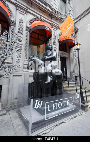 'Voluptuous Man On Horse' a bronze sculpture by Botero,  flanks the entrance to the Love Hotel, in Montreal, Quebec, Canada. Stock Photo