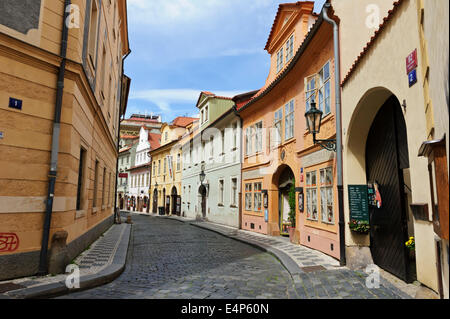 A traditional narrow street in Prague with of a row of hotels and restaurants, Prague, Czech republic. Stock Photo