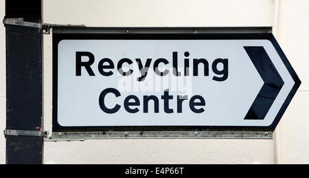 Metal signpost points right to a Recycling Centre Stock Photo