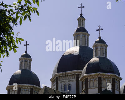 Triple Domes with Crosses. Three of the domes of the Ukrainian Catholic Cathedral in Edmonton, topped with an ornate iron cross Stock Photo